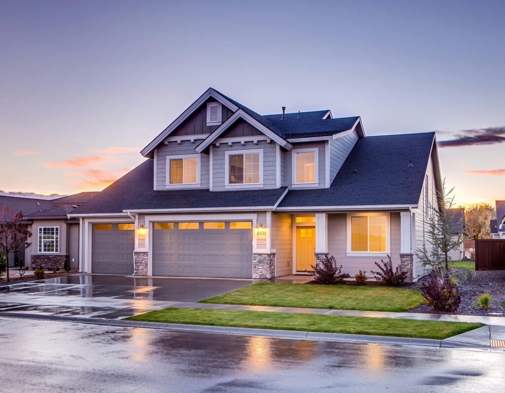 Elegant suburban home with driveway at sunset showcasing modern architecture.