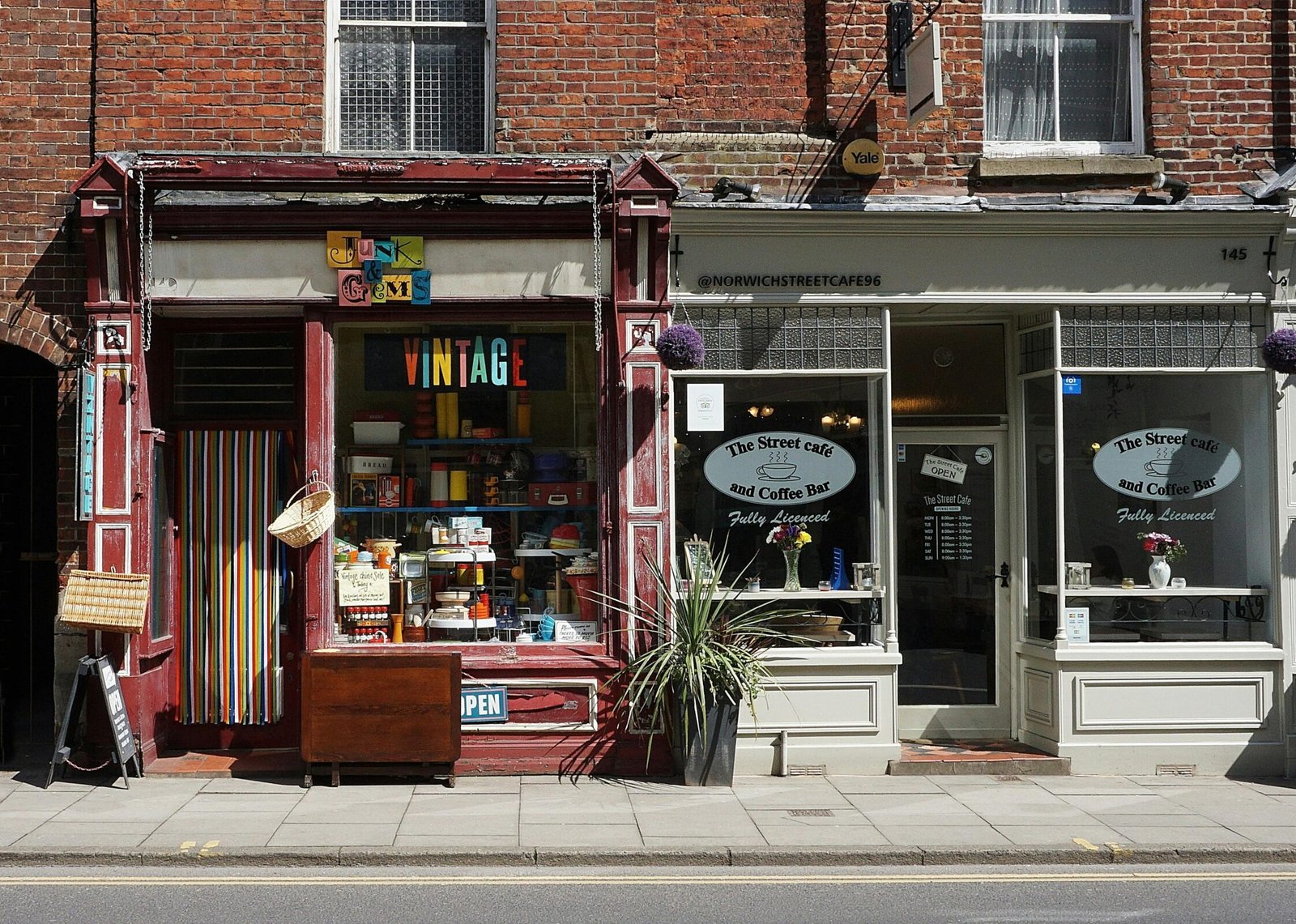 Vintage shop and cafe in Norwich showcasing eclectic storefronts and vibrant signage.